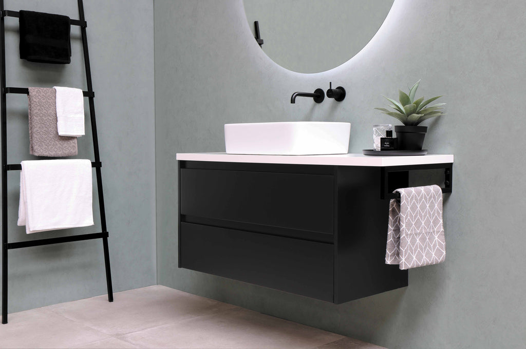 A modern bathroom has an elegant tiled wall and furniture, in the style of monochrome hues